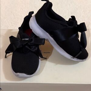 U.S. POLO ASSN. Kids Toddler Black & White Slip-On Sneakers with Satin Bow